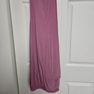 Iridescent. Pink. Two Piece. Gently used. 95% Polyester. 5% Spandex. Size: XL.